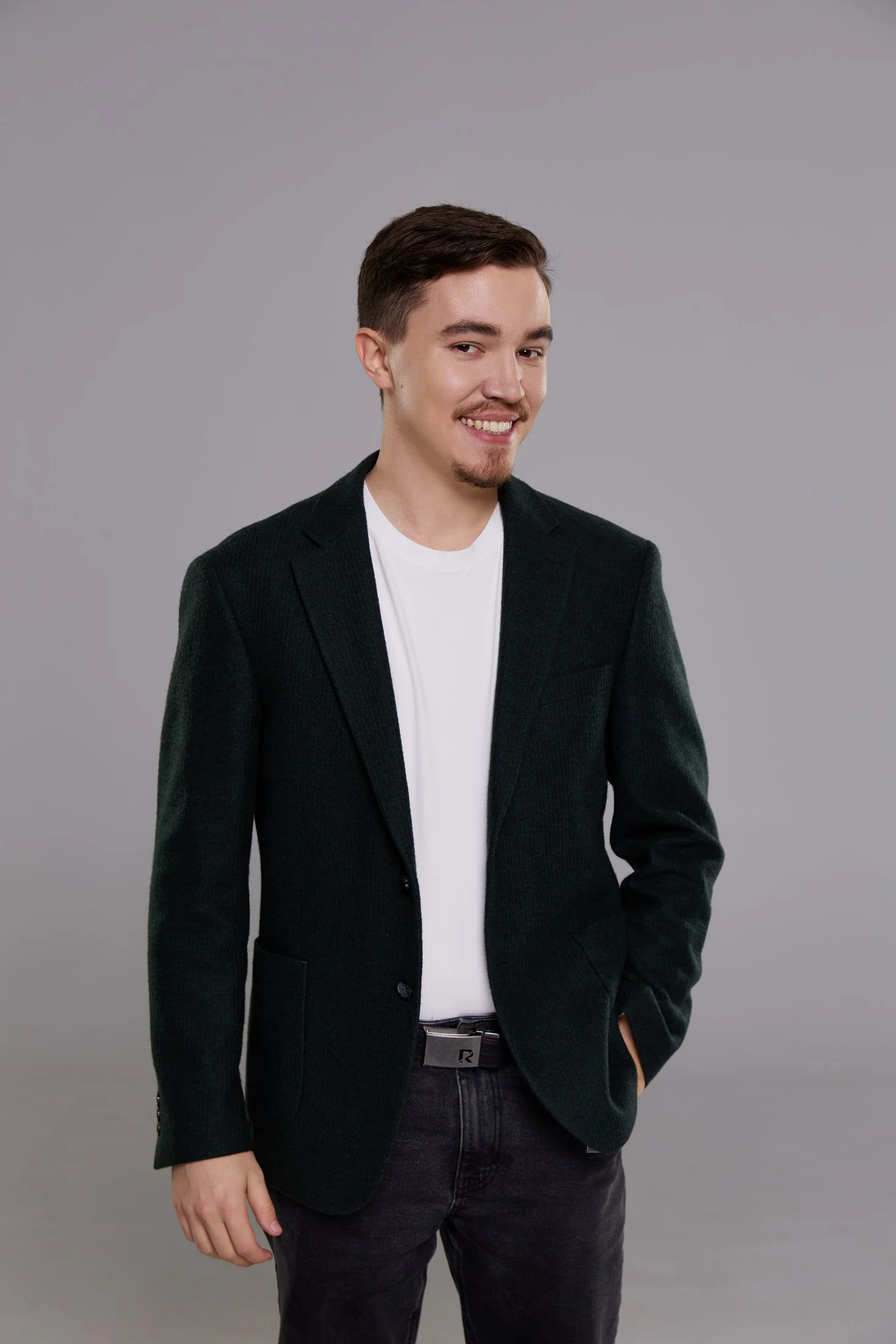 Dima Krupnov smiling, wearing a black blazer